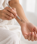 Acupressure point pen with fine precision tip and broader massage end